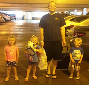 The kids help walk daddy to the van. Note all the things Natalie is carrying.
