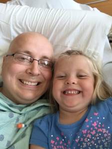 Natalie hanging out in my hospital bed.